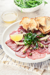 Beef carpaccio with arugula and parmesan