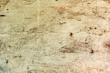 Texture of a concrete wall with cracks and scratches which can be used as a background
