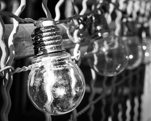 Monochromatic light globes, abstract black and white glass, steel and reflections.