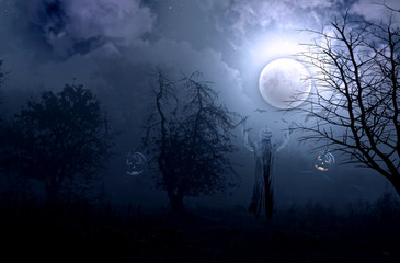 Night foggy mystical garden and a scarecrow against the backdrop of the full moon