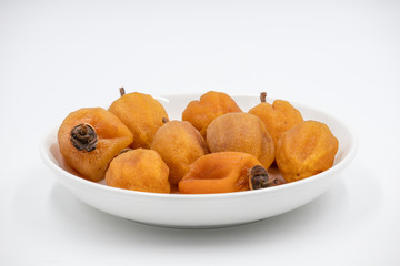Dry hoshigaki persimmon on white