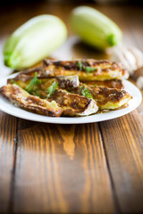 oven-baked zucchini in batter with garlic and herbs
