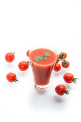 homemade tomato juice in a glass and fresh tomatoes