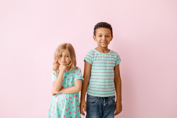 Cute little children on color background