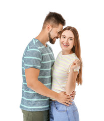 Fototapeta premium Portrait of happy young couple on white background