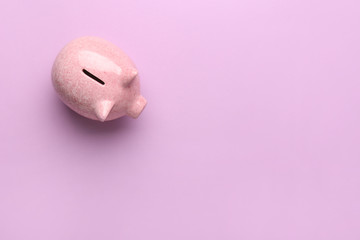 Piggy bank on color background