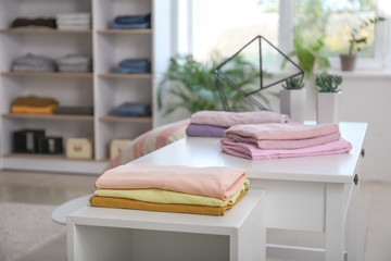 Stacked clean clothes in show room