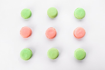 Tasty macarons on white background