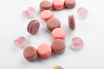 Tasty macarons on white background