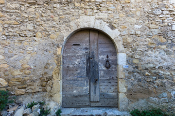 medieval arched doors and windows in a village in Provence