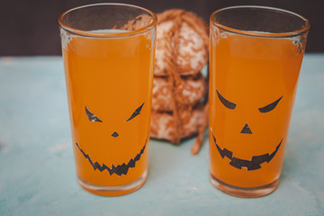 glasses with spooky pumpkins and cookies for Halloween
