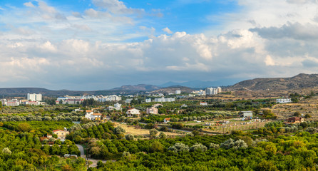 Fototapeta na wymiar Lefka town panorama with modern buildings and green residential suburbs, Northern Cyprus