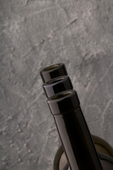 bottlenecks of a red wine , close up. gray background