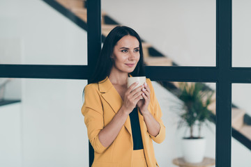 Portrait of her she nice attractive charming cute lovely cheery lady drinking hot cacao latte fresh start day in modern style light white glass interior apartment indoors