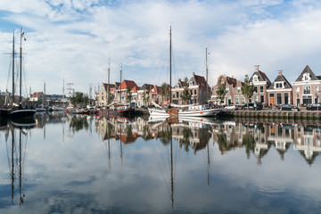 Fototapeta na wymiar Boats in south harbour canal of Harlingen, Netherlands