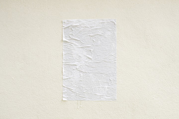 Blank white crumpled and creased adhesive street poster mockup on concrete wall background