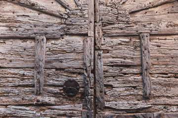 detail of an old wooden door seen in a village of Provence