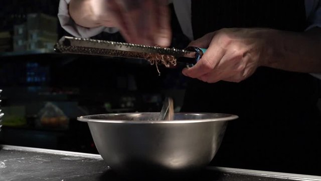 Close up of chef slice black truffle in slow motion