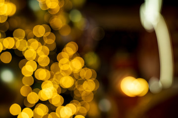 Colorful orange bokeh background of Christmas lights and New year