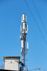 Technology on the top of the telecommunication GSM 5G,4G,3G tower.Cellular phone antennas on a building roof.Telecommunication mast television antennas.Receiving and transmitting stations