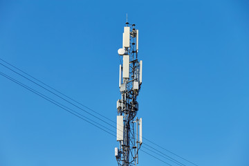 Technology on the top of the telecommunication GSM 5G,4G,3G tower.Cellular phone antennas on a building roof.Telecommunication mast television antennas.Receiving and transmitting stations