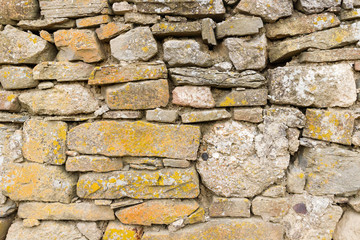 Texture of a antique stone wall. Old castle stone wall texture background. Stone wall as a background or texture.