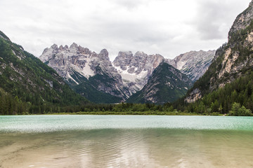 Dolomites, Italy - July, 2019: Big majestic mountains, view of Lake Landro Lago di Landro Cristallo group the Dolomites, Italy