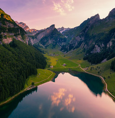 Aerial view of the Seealpsee lake in the Swiss Alps at sunset