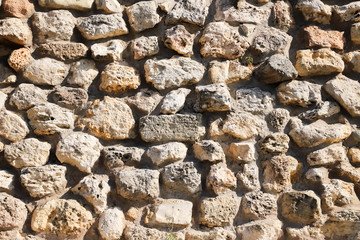 Texture of a antique stone wall. Old castle stone wall texture background. Stone wall as a background or texture.