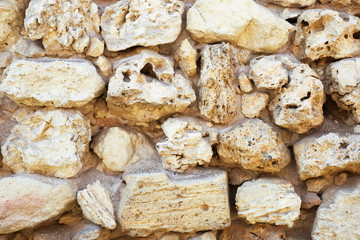 Texture of a antique stone wall. Old castle stone wall texture background. Stone wall as a background or texture.