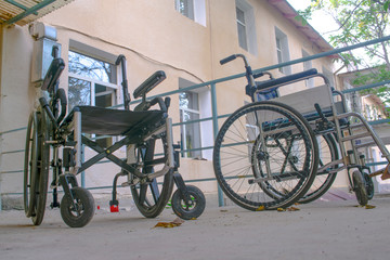 Fototapeta na wymiar Wheelchairs in the Parking lot in the balcony.