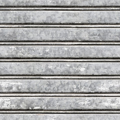 Seamless texture of gray vintage oxidized rolling steel door. Pisa. Italy.