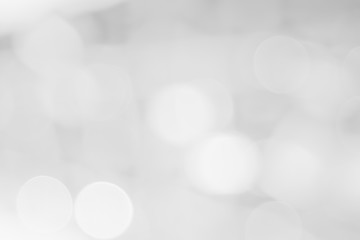 Abstract white bokeh with soft blurred background nature blurry light party in vintage style warm shimmering and faded colorful defocused circular modern. Gray silver shiny copy space for holiday.
