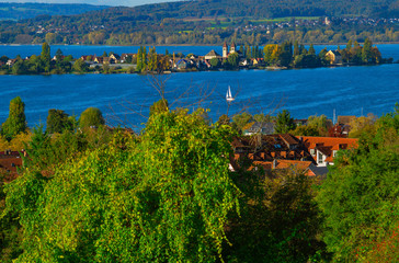 Fototapeta na wymiar Early autumn on Lake Constance. View from a hill above the village Allensbach on the western Lake Constance with the island Reichenau on a really rare clear day.