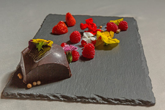 Chocolate cake with raspberry served in the restaurant