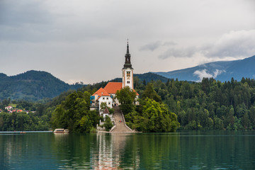 Bled, Slovenia - July, 2019: Lake Bled with St. Marys Church of Assumption on small island....