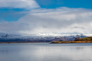 snow covered mountains and lake