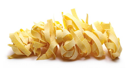 Raw pasta, pappardelle isolated on white background