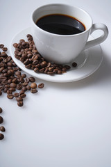 cup of coffee and coffee beans with space