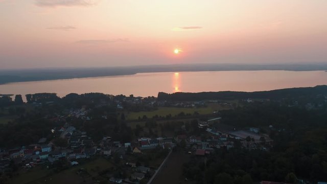 Aerial over Joachimsthal town towards lake into the sunset, Germany