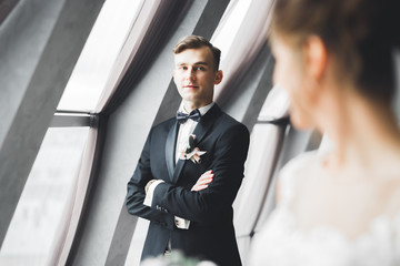 Headshot portrait of young man smiling isolated on outside outdoors background