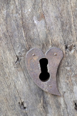 heart-shaped lock. Old door with lock