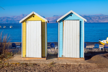 Obraz na płótnie Canvas Beautiful yellow and blue public toilet at the beach near Sidari in Corfu, Greece