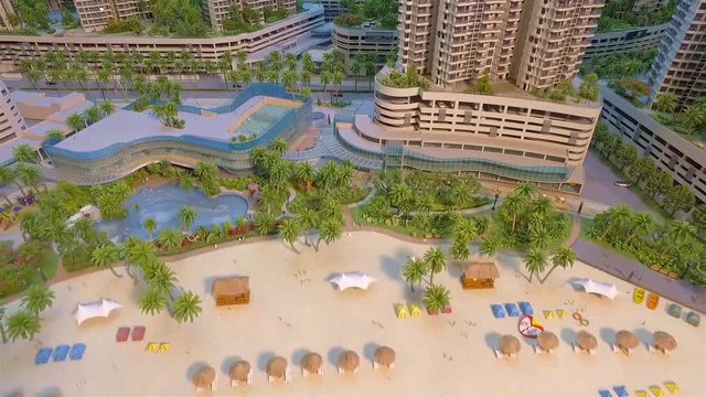 Top View Of Beautiful Skyscrapers With Beach And Sea - Tilt Up - Backwards 