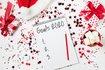 Mock up for Goal List New 2020 year. Christmas decor. Planning and to Do List with red Holiday decor.
