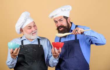 This should be fine. Chef men cooking. cheerful men prepare food. professional restaurant cook. new recipe. Perfect taste. taste food. culinary concept. mature senior bearded men in kitchen