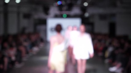 models on the catwalk in defocus. fashion Week