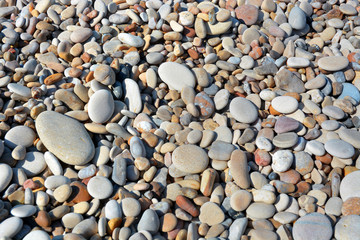 Background of marine pebbles smoothed by sea water.