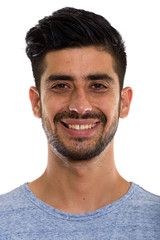 Fototapeta premium Face of young happy Persian man smiling