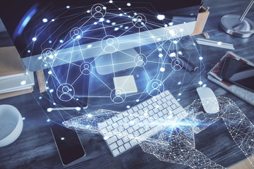 Computer on desktop with social network theme icon. Multi exposure. Concept of international connections.